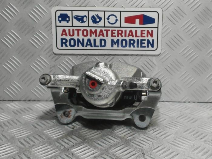 Front brake calliper, right from a Volkswagen Caddy IV 2.0 TDI 2021