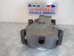 Used Front brake calliper, left Opel Corsa IV 1.2 16V Price € 35,00 Margin scheme offered by Automaterialen Ronald Morien B.V.
