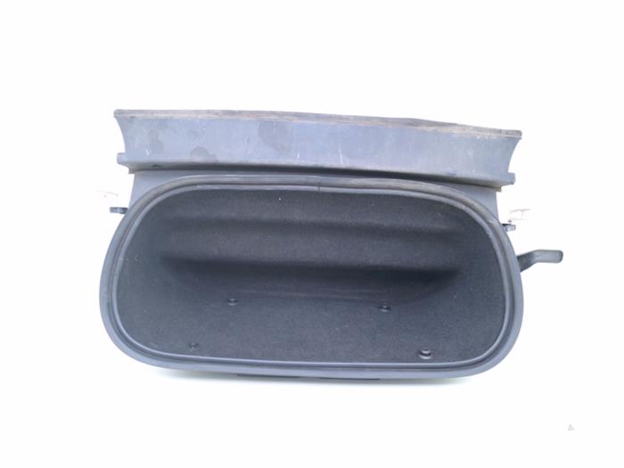 Front trunk storage compartment