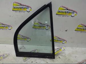 Usagé Vitre triangulaire arrière droite Mitsubishi Carisma 1.8 GDI 16V Prix € 36,75 Règlement à la marge proposé par Binckhorst BV