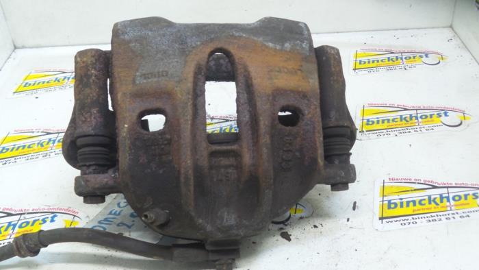 Front brake calliper, left from a Opel Omega B (25/26/27) 2.0i 16V 1998