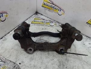 Used Front brake calliperholder, left Opel Corsa D 1.4 16V Twinport Price € 15,75 Margin scheme offered by Binckhorst BV