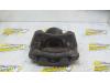 Front brake calliper, left from a Renault Clio III (BR/CR) 1.5 dCi 85 2005