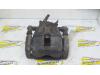 Front brake calliper, left from a Renault Clio III (BR/CR) 1.5 dCi 85 2005
