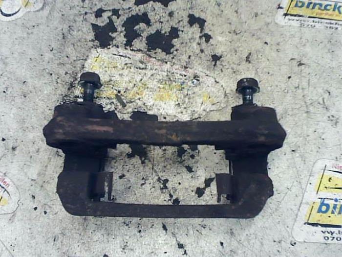 Rear brake calliperholder, left from a Kia Picanto (BA) 1.0 12V 2005