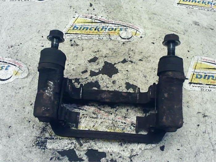 Rear brake calliperholder, left from a Kia Picanto (BA) 1.0 12V 2005
