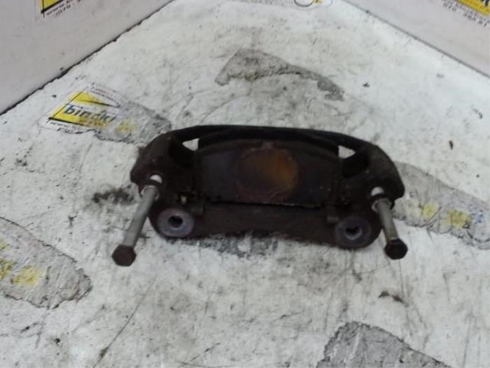 Front brake calliperholder, left from a Toyota Starlet (EP9) 1.3,XLi,GLi 16V 1997
