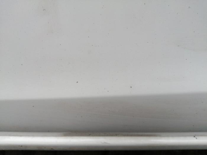 Door 4-door, front left from a Daihatsu Cuore (L251/271/276) 1.0 12V DVVT 2008