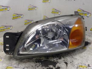 Used Headlight, left Ford Fiesta 4 1.25 16V Price € 36,75 Margin scheme offered by Binckhorst BV