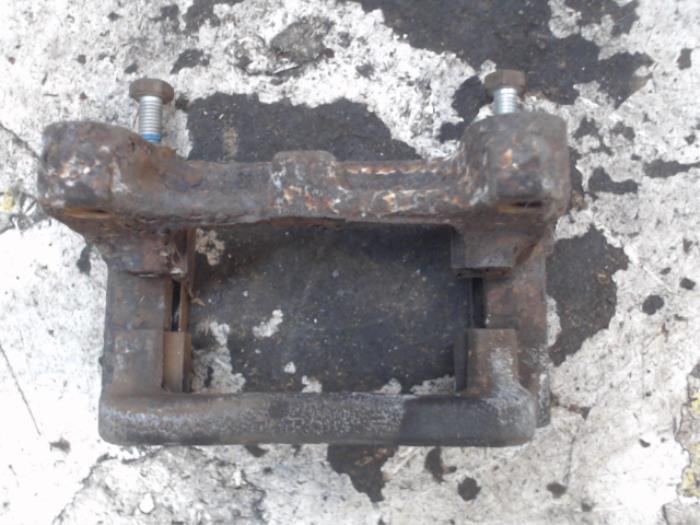 Rear brake calliperholder, left from a Ford S-Max (GBW) 2.0 TDCi 16V 140 2009