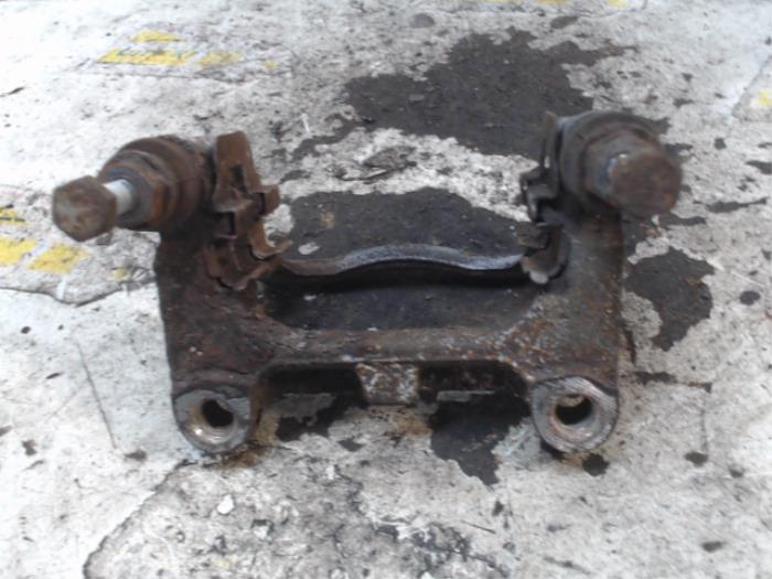 Rear brake calliperholder, left from a Ford S-Max (GBW) 2.0 TDCi 16V 140 2009