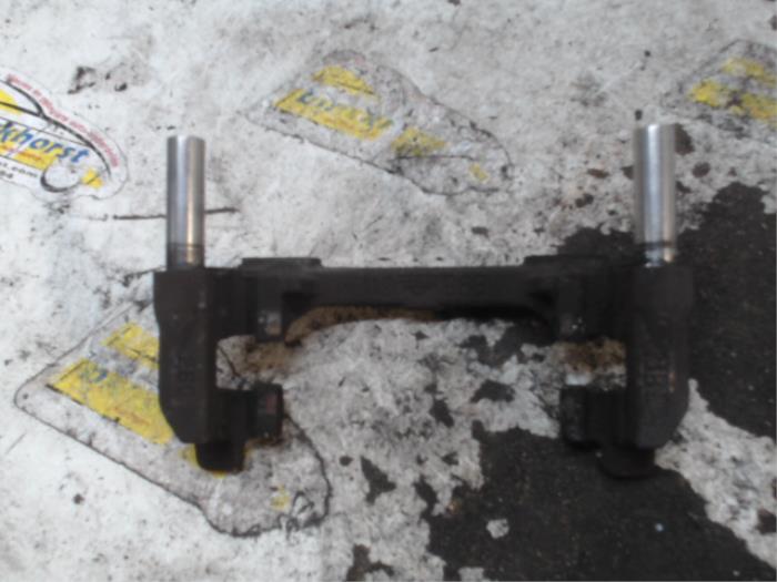 Rear brake calliperholder, left from a Ford Transit Connect (PJ2) 1.5 EcoBlue 2022