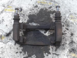 Used Front brake calliperholder, left Nissan Note (E11) 1.4 16V Price € 21,00 Margin scheme offered by Binckhorst BV