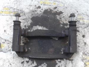 Used Front brake calliperholder, left Toyota Corolla (E12) 1.4 16V VVT-i Price € 15,75 Margin scheme offered by Binckhorst BV