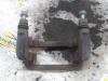 Rear brake calliperholder, left from a Hyundai i10 (B5) 1.0 12V 2014