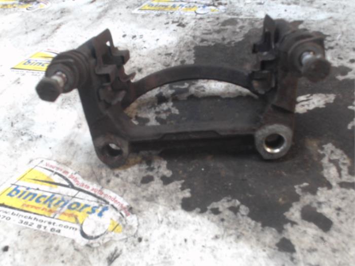 Rear brake calliperholder, left from a Volkswagen Transporter T5 2.0 TDI DRF 2012