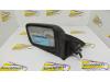 Wing mirror, left from a Nissan Sunny 1989