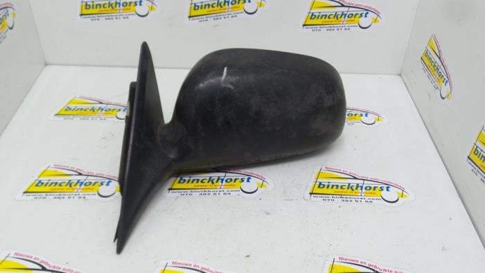 Wing mirror, left from a Mitsubishi Colt 1995
