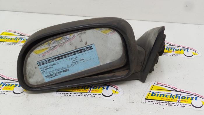 Wing mirror, left from a Mitsubishi Colt 1995