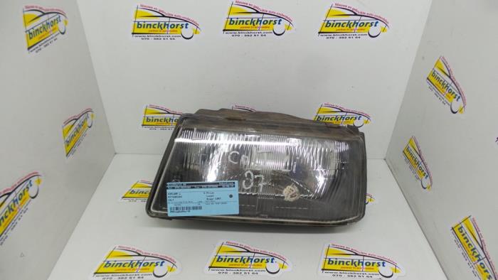 Headlight, left from a Mitsubishi Colt 1987