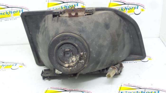 Headlight, left from a Ford Courier (FVJ) 1.8D 1995