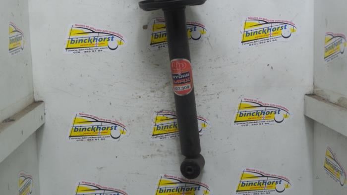 Rear shock absorber rod, left from a Volkswagen Golf III (1H1) 1.4 CL 1997