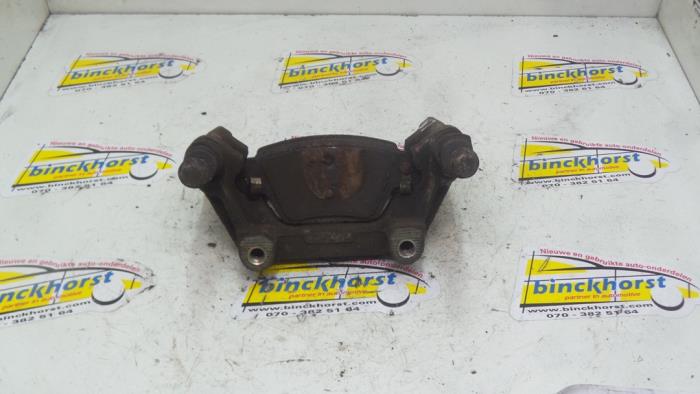 Rear brake calliperholder, left from a Ford Mondeo III 2.0 TDCi 130 16V 2002
