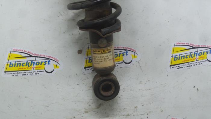 Rear shock absorber rod, left from a Toyota Corolla (E12) 1.8 16V TS VVT-i 2004