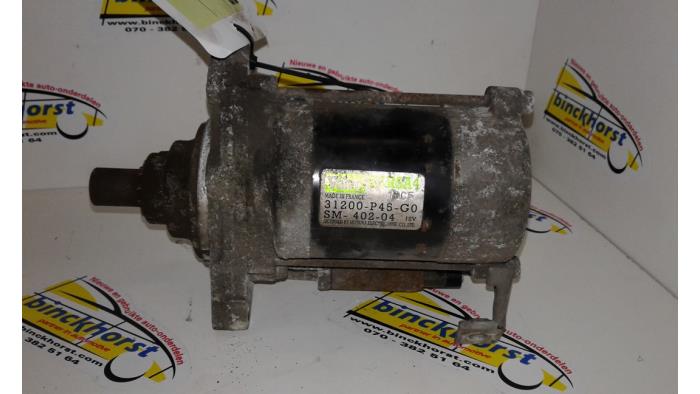 Anlasser van een Honda Accord (CC75/76) 2.0i 16V 1996