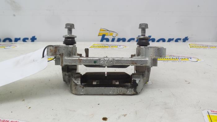 Rear brake calliperholder, left from a Mitsubishi Outlander (GF/GG) 2.2 DI-D 16V Clear Tec 4x2 2013
