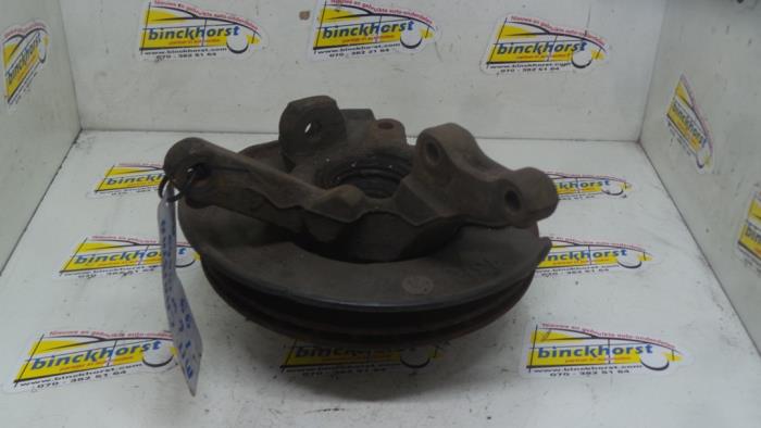 Knuckle, front right from a Mitsubishi Carisma 1.6i 16V 1999