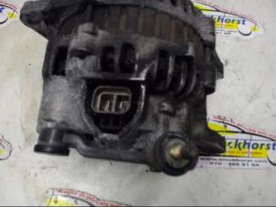 Dynamo van een Ford (USA) Probe II 2.0i 16V DOHC SEFI 1994