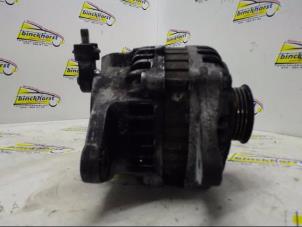 Dynamo van een Ford (USA) Probe II 2.0i 16V DOHC SEFI 1994