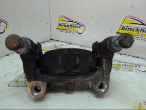 Used Rear brake calliperholder, left Opel Astra H SW (L35) 1.6 16V Twinport Price € 26,25 Margin scheme offered by Binckhorst BV