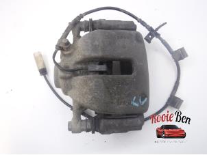 Used Front brake calliper, left Mini Clubman (R55) 1.6 16V Cooper Price on request offered by Rooie Ben autodemontage