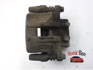 Used Rear brake calliper, left Dodge Caliber 1.8 16V Price € 75,00 Margin scheme offered by Rooie Ben autodemontage