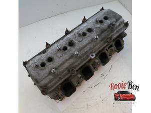 Used Cylinder head Chrysler 300 C 5.7 V8 Hemi Price on request offered by Rooie Ben autodemontage