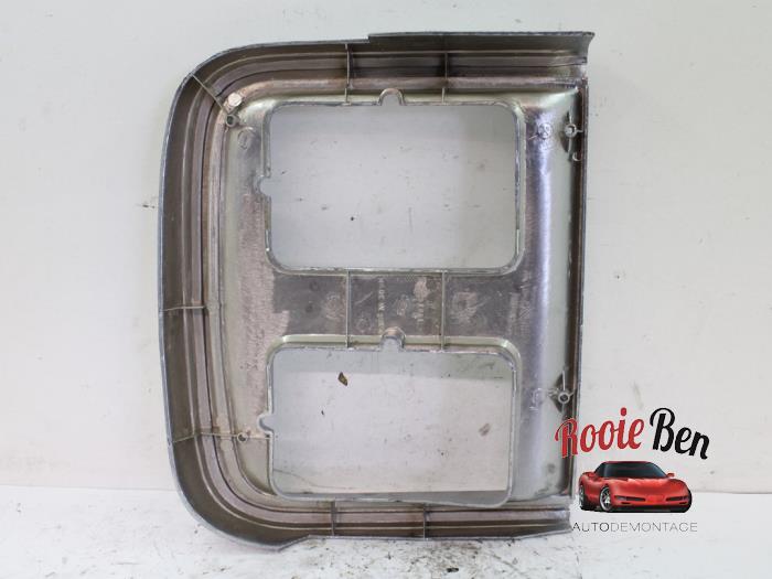 Headlight frame, left from a Chevrolet Chevy/Sportsvan G20 5.0 4BBL. 1986