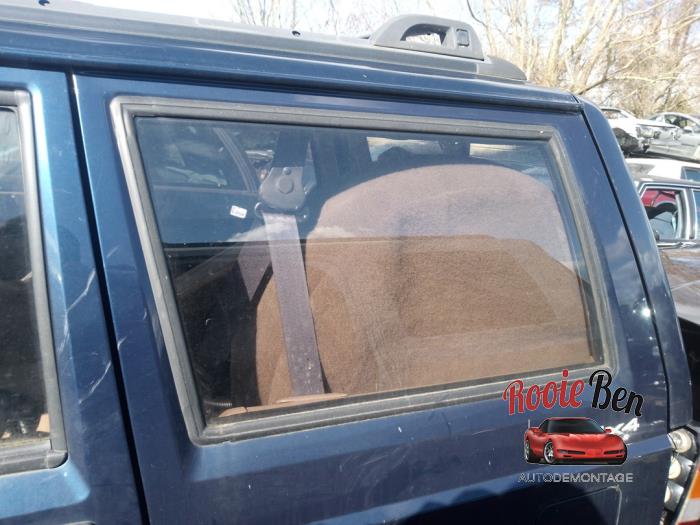 Extra window 4-door, left from a Jeep Cherokee (XJ) 4.0 i 1999