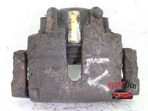 Used Front brake calliper, left Chrysler Sebring (JR) 2.0 16V Price on request offered by Rooie Ben autodemontage