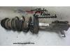 Front shock absorber rod, left from a Opel Astra 2011