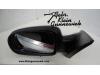 Wing mirror, left from a Opel Tigra 2006