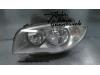 Headlight, left from a BMW 1-Serie 2008