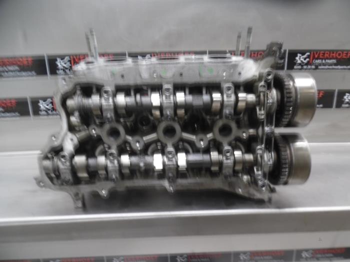 Cylinder head from a Nissan / Datsun Micra (K13) 1.2 12V DIG-S 2012