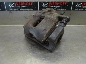 Used Front brake calliper, left Renault Modus/Grand Modus (JP) 1.4 16V Price on request offered by Verhoef Cars & Parts