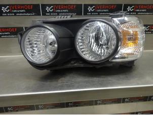 Używane Reflektor lewy Chevrolet Aveo 1.4 16V Cena € 100,00 Procedura marży oferowane przez Verhoef Cars & Parts