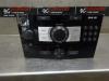 Radio CD player from a Opel Corsa D 1.4 16V Twinport 2014