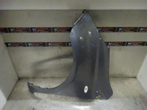 Used Front wing, left Nissan Note (E11) 1.4 16V Price € 75,00 Margin scheme offered by Verhoef Cars & Parts