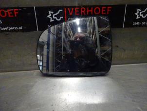 Used Mirror glass, left Nissan Note (E11) 1.4 16V Price on request offered by Verhoef Cars & Parts
