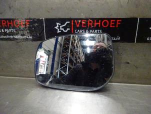 Used Mirror glass, left Toyota Yaris II (P9) 1.0 12V VVT-i Price on request offered by Verhoef Cars & Parts